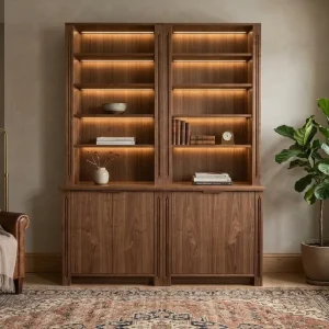A walnut modular DIY bookcase with integrated lighting and lower cabinets styled in a warm living room. Plans de bibliothèque haut de gamme. Plans de bibliothèque haut de gamme.